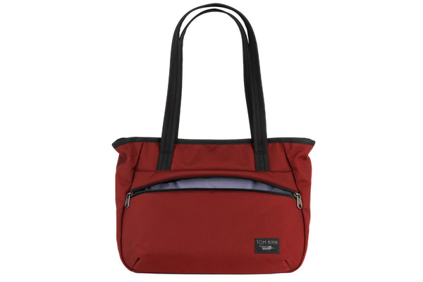 Photo of the Nomad Tote in Mars Red Ballistic with Dusk (purplish-blue with dark bluish-purple grid) 210 Cerylon interior.